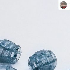 two ice cubes sitting next to each other on top of a white countertop