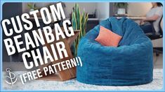 a blue bean bag chair sitting on top of a white rug next to a potted plant