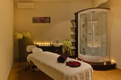 a spa room with white towels on the table