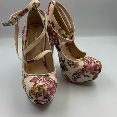 Very Cute, Very High Heel, Flowery, Strappy Pump. Beautiful Off White Fabric With Flowers Covers The Entire Shoe. Cross Straps Join Into Ankle Strap. 5.75” Heel, With 1.5” Platform Shoes Are Brand New. P-106 White Heels Pink Flowers, Floral Print Heels For Spring, Fitted Floral Print Heels For Spring, Spring Heels With Floral Print And Ankle Strap, Chic Floral Print Heels With Round Toe, Spring Floral Print High Heels, Chic Closed Toe Floral Print Heels, Beige Fabric Heels For Spring, Feminine Fitted Heels With Floral Print