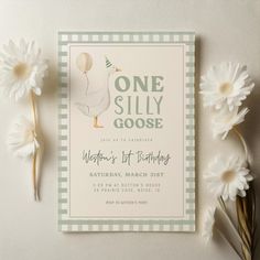 a birthday card with a goose on it next to some daisies and white flowers