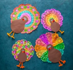 paper plate turkeys made with crochet doily on a blue tablecloth