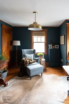 a living room with blue walls and furniture