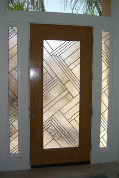 a wooden door with glass panels on it