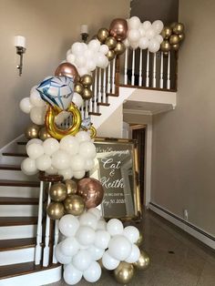 some balloons are hanging on the stairs