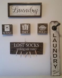 some signs are hanging on the wall next to a toothbrush