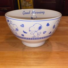 a bowl sitting on top of a wooden table