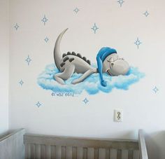 a child's bedroom with a mural of a cartoon character sleeping on a cloud