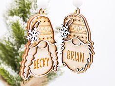 two wooden earrings with the words becky and brain printed on them