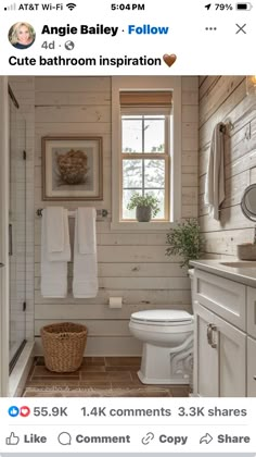 a white bathroom with wood paneling and tile on the walls is featured in an instagram