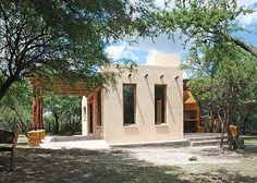 a small house in the middle of some trees