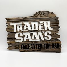 a wooden sign that says trader sam's enchantel like bar