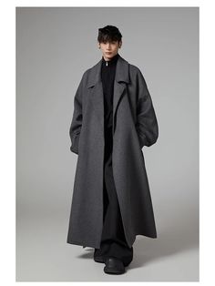 Redefine sophistication with this oversized, extra-long trench coat. Crafted from a premium wool-blend, it merges timeless style with a modern, commanding presence. The perfect piece for the man who values bold luxury and versatile elegance. Essential Features: Premium Wool-Blend: Offers warmth and durability. Extra Long Design: Creates a dramatic, statement-making look. Oversized Fit: Bold, relaxed silhouette for maximum style. Timeless Elegance: Classic trench coat details for versatility. Limited Edition: Exclusively for those who seek luxury in every detail. Size Chart Measurements are in inches. Size Bust Sleeve Length S 52.76 31.89 49.21 M 56.69 33.07 50.39 L 60.63 34.25 51.57 Oversized Solid Wool Outerwear, Oversized Solid Wool Coat For Business, Oversized Solid Wool Pea Coat, Oversized Solid Single Breasted Wool Coat, Classic Oversized Solid Pea Coat, Oversized Solid Single-breasted Wool Coat, Classic Oversized Long Wool Coat, Classic Long Oversized Wool Coat, Oversized Long Classic Wool Coat