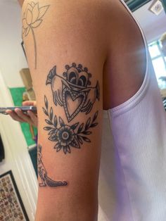 a woman with a tattoo on her arm