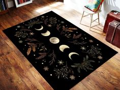 a black area rug with the moon and stars on it