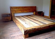 a bed frame made out of wooden planks