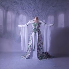 a woman's dress is displayed in front of a white background with arches and arched windows