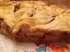 a piece of pie sitting on top of a colorful plate