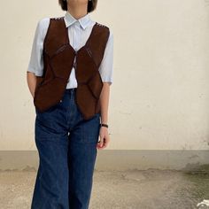 Vintage 70's Dark Brown Suede Leather Vest Short vest, very special, reversible: on both sides the vest is identical and the buttons can be turned on both sides Mesh vest in lightweight fabric and suede patch the label has been removed Recommended size International from S to M - Italian from 40 to 44 / European from 36 to 40 The girl in the photo wears Italian size 40 / European size 36 / international size S Measurements in cm: Shoulders 34 chest (pit-pit) 48 length 43 General conditions: vint Brown Leather Vest, Vest Outfits For Women, Vintage Leather Vest, Women Leather Vest, Mesh Vest, Waistcoat Woman, Leather Waistcoat, Suede Shorts, Corduroy Coat