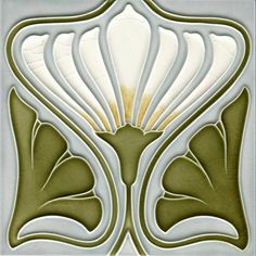 an art deco tile design in green and white