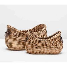 two wicker baskets sitting side by side