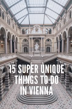 the inside of an old building with stairs and arches in vienna, germany text reads 15 super unique things to do in vienna