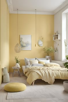 a bedroom with yellow walls and white furniture