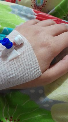 a hand with an iv attached to it