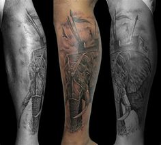 two men with tattoos on their legs, one is holding a cross and the other has an elephant