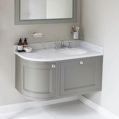 a bathroom sink with a mirror above it