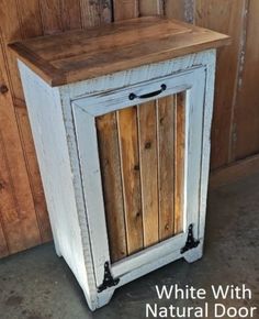 an old white cabinet with wooden doors