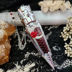 Our 𝕭𝖊𝖑𝖑𝖆 𝖒𝖔𝖗𝖙𝖊 blood vial necklace certainly makes a statement with its large and ornate in your face design now with celestial elements and Swarovski crystal adorned chain Our FAKE BLOOD vial comes pre filled and sealed with our own secret blend of pigments.  All on a stainless steel /or electroplated chain with soldered links for ultimate strength and durability. - 4.5 inch long statement making PLASTIC vial pendant. lightweight and gorgeously detailed.  - Secret formula "vampire bl Blood Necklace Vial, Vampire Items, Blood Vial Necklace, Blood Jewelry, Blood Necklace, Jewelry Vampire, Necklace Vampire, Vial Pendant, Vampire Necklace