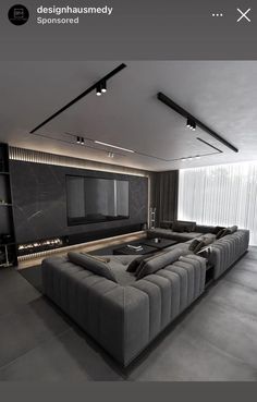 a living room filled with furniture and a flat screen tv mounted to the side of a wall