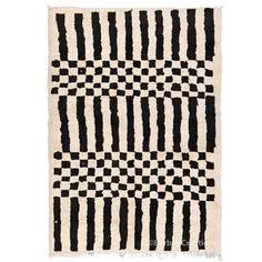 a black and white rug with stripes on it