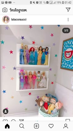 two shelves with barbie dolls on them in a room that is decorated with stars and polka dots