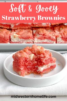 soft and gooey strawberry brownies on a white plate with the title in red