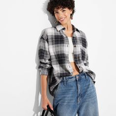 Flannel button-down shirt from Wild Fable™ with a plaid pattern. Made from lightweight cotton. Designed in an oversized fit with a collared neckline, full front button-down closure, chest patch pocket and long sleeves with buttoned cuffs. Tunic-length shirttail hem completes the stylish look. If you're not satisfied with any Target Owned Brand item, return it within one year with a receipt for an exchange or a refund. Wild Fable™: A look for every story. Clothes Board, Western Denim Shirt, Pocket Tunic, Oversized Flannel, Effortless Outfit, Long Sleeve Flannel, Hem Style, Rolled Hem, Pink Plaid