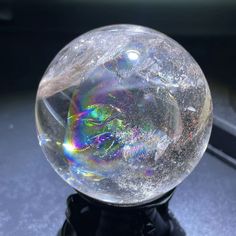 a crystal ball sitting on top of a black stand