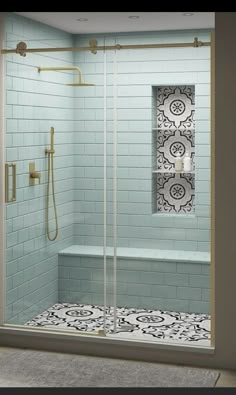 a walk in shower sitting next to a white tiled wall and floor covered in black and white tiles