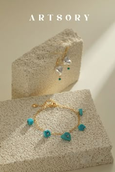 Immerse yourself in the artistry of nature with our "Aqua Elegance" Turquoise Stone Bracelet. Handcrafted with artistry and inspired by the ocean's cool breeze, this exquisite piece combines 14K gold with vibrant turquoise, radiating timeless charm. Whether stacked or worn solo, it's a masterpiece in simplicity, adding an elegant touch to any style. Turquoise Stone Bracelet, Jewellery Photography Inspiration, Jewelry Product Shots, Creative Jewelry Photography, Bali Jewelry, Jewelry Photography Styling, Jewellery Photography, Turquoise Drop Earrings, Jewelry Photoshoot