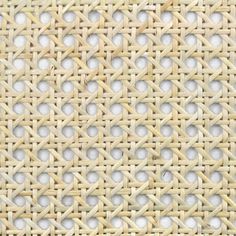 an image of woven material with holes in the center and white circles on it's surface