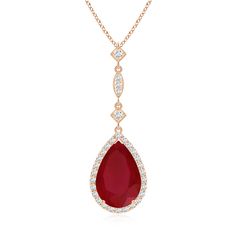 A ruby shaped like a teardrop is nestled within a glimmering halo of precious diamonds. The linear arrangement of station diamonds is linked to the glowing ruby to form a stylish long drop design. Drop Design, Ruby Pendant, Teardrop Pendant, Drops Design, Halo, Ruby, Diamonds, Yellow Gold, Rose Gold