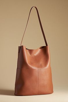 Tall Bucket Bag Soft Leather Pouch Bag For Everyday, Leather-handled Hobo Bag For Errands, Leather-handled Hobo Pouch Bag For Errands, Versatile Soft Leather Pouch Hobo Bag, Versatile Soft Leather Hobo Pouch Bag, Modern Hobo Pouch Bag For Everyday Use, Modern Soft Leather Pouch Bag, Modern Brown Bag For Errands, Modern Brown Bags For Errands