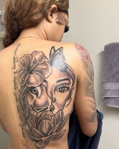 a woman with a tattoo on her back