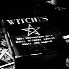 a black and white photo of a book with the words witches written on it's cover