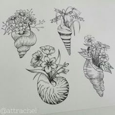 three vases filled with flowers and plants on top of a white paper wallpaper