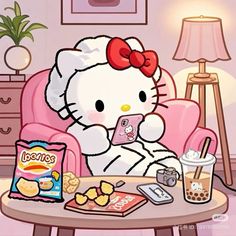 a hello kitty sitting in a pink chair holding a cell phone