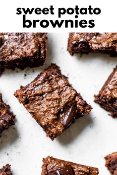 four brownies are sitting on a white surface with text overlay that reads gluten free dairy free flourless pumpkin fudge brownies