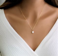 Pearl Necklace, Dainty Necklace for Women, Bridesmaid Jewelry, Freshwater Baroque, Minimalist Dainty Gift for Her, Gold, Silver Necklace Beautiful, Easy & Effortless Pearl Necklace - This makes a great gift for mom, friends and bridesmaids!   This necklace will go with everything and make your outfit super chic with an understated elegance.  You can't go wrong with this necklace! IT'S IN THE DETAILS ✦ 14K Gold Filled, Sterling Silver or Rose Gold Chain and Components ✦ White Baroque Pearl Charm-  approx 8x13mm (Your pearl will be similar the one shown in the photo. Every pearl is unique and different in size and shape)   We are so thankful for every single order you place with us! If this is a gift we can ship directly to the recipient and include a personalized note. Not to worry, we neve Minimalist Teardrop Pearl Necklace, Minimalist Pearl White Pear-shaped Jewelry, Elegant Jewelry With Delicate Pear-shaped Chain, Delicate 14k Gold Pearl Necklace For Wedding, Elegant 14k Gold Filled Jewelry For Bridesmaid Gift, Elegant 14k Gold Filled Necklace For Wedding, Elegant 14k Gold-filled Jewelry With Simple Design, Elegant 14k Gold Filled Jewelry With Simple Design, Elegant Pear-shaped Jewelry With Delicate Chain