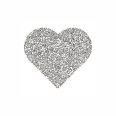 a silver heart shaped object with lots of small sparkles on it's side